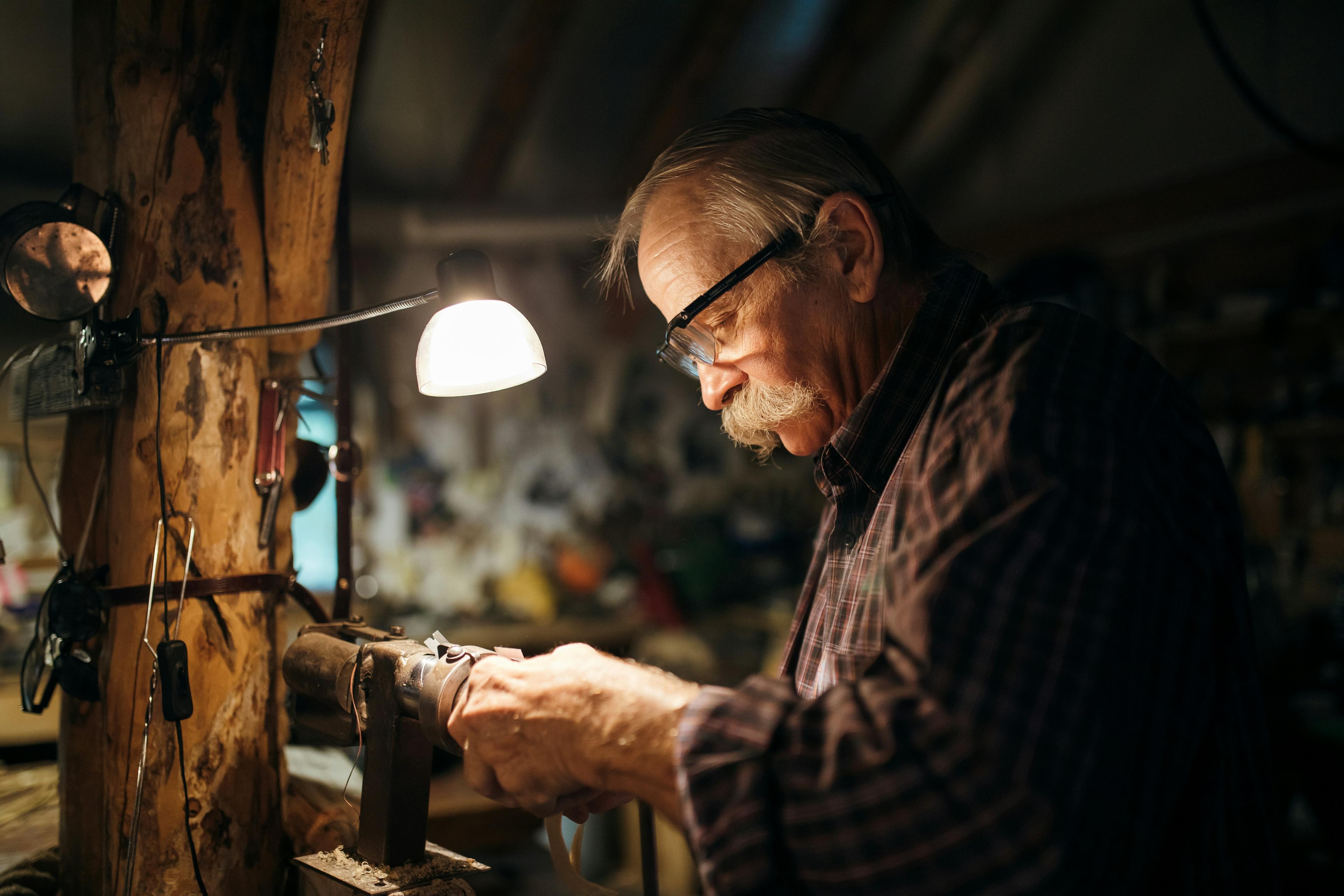 Experienced carpenter working with hand tools in a workshop